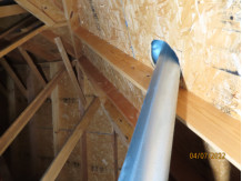 Furnace Flue in contact with roof (combustible)